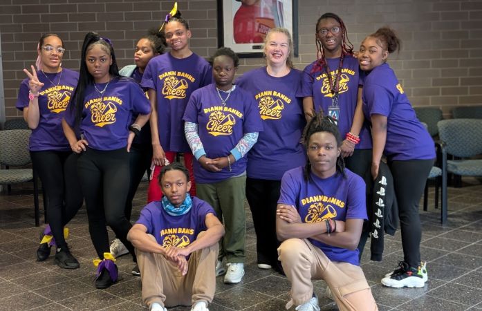  Students and teacher cheer team group picture